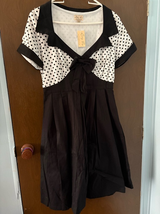 Lindy Bop Dresses & Skirts - Lindy Bop Black and White Polka Dot Bow-Front Dress